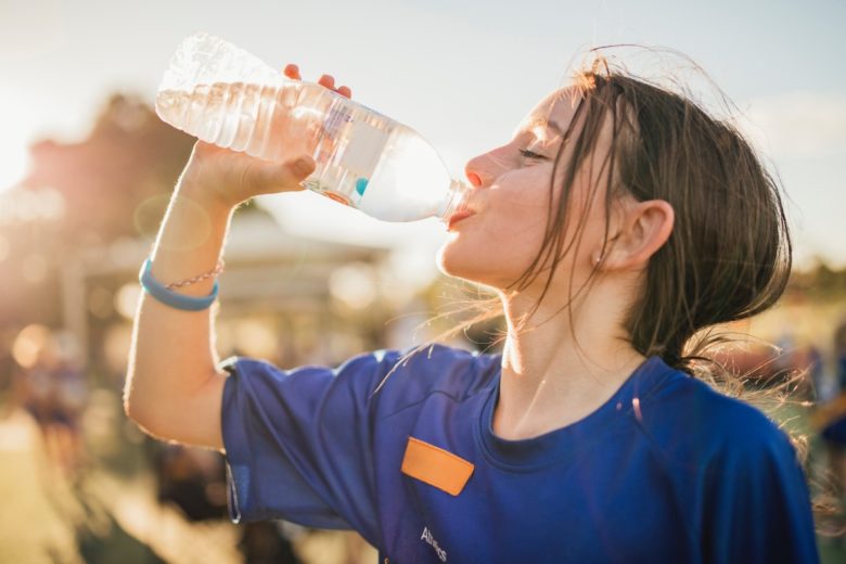 sports person hydrating after sports